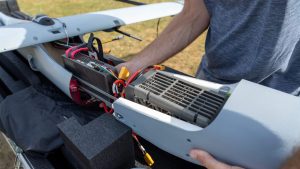 close up of someone inspecting a hydrogen fuel cell aircraft part